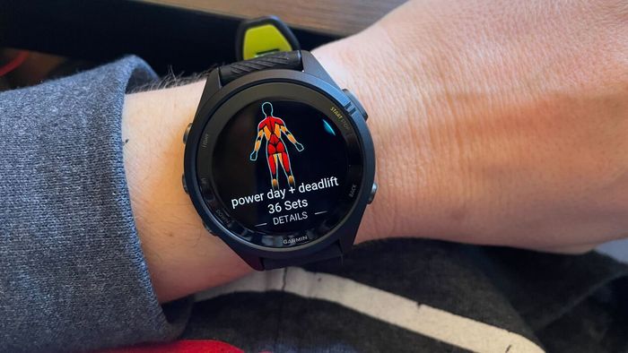 Garmin watch displaying a workout with muscle map visualization