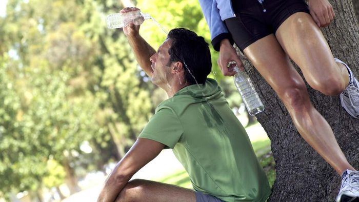 individuals using water to cool themselves