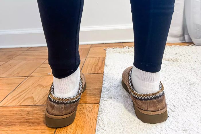 A person wearing Ugg Tasman slippers with style