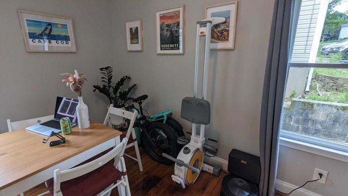 Q1SW rowing machine positioned against the wall.