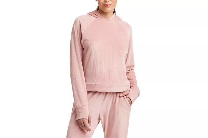 The All In Motion Women's Velour Ribbed Hooded Sweatshirt combines comfort with style. Its velour material offers a soft, luxurious feel, while the ribbed texture and hood provide a cozy yet fashionable look.