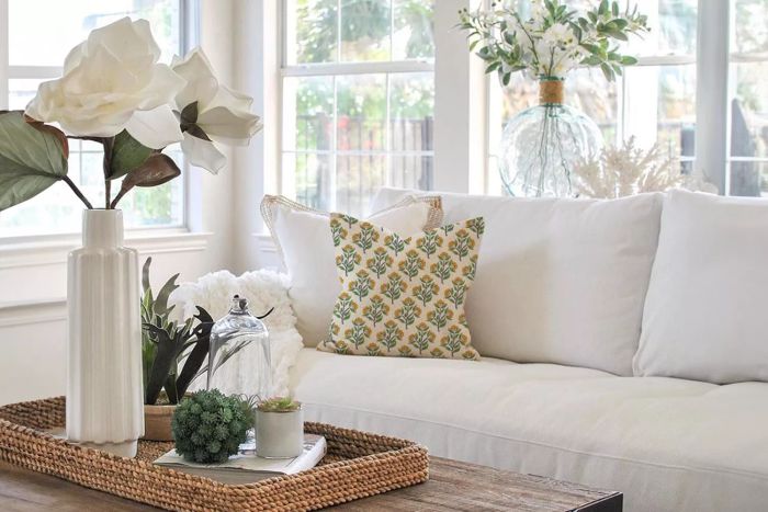2025's most popular home decor trends include a white and green color palette for the living room.