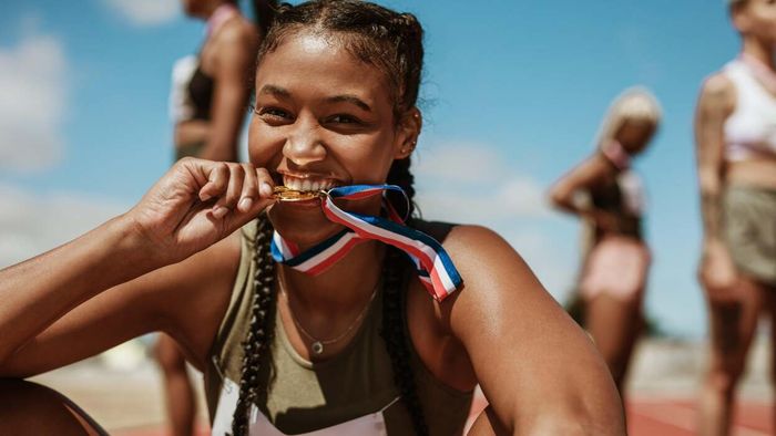 athlete holding a medal