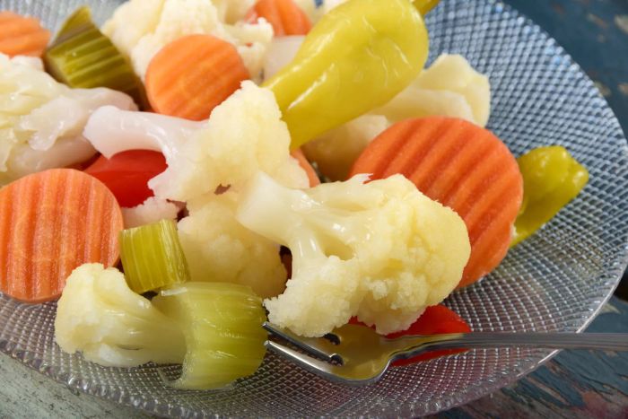 A classic Italian or Italian-American condiment or antipasto, fermented girardiniera features a blend of mixed pickled vegetables, including cauliflower, celery, carrots, and peppers.
