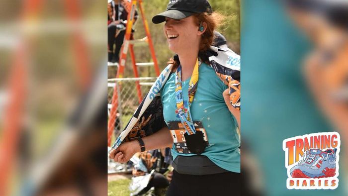 Meredith beams with pride, celebrating her successful marathon finish.