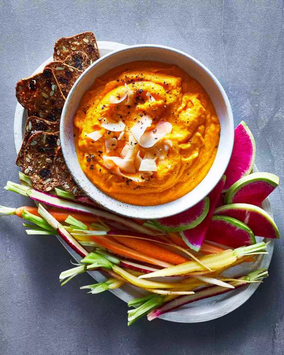 Carrot Ginger Dip: A smooth and flavorful dip made with cooked carrots, spicy ginger, and a touch of maple syrup. Blend these with garlic for a bold flavor, then drizzle with olive oil for richness. Serve at room temperature with fresh vegetables, pita chips, or your preferred dipping snacks.
