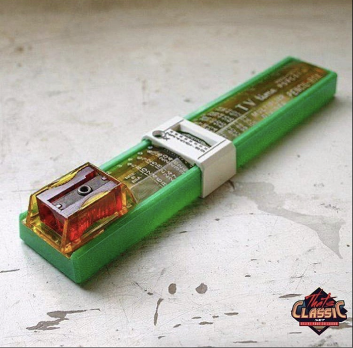 A vintage, green TV remote from the 1970s with a simple design, displaying 'ULTRASONIC 4000' text and a logo in the corner.