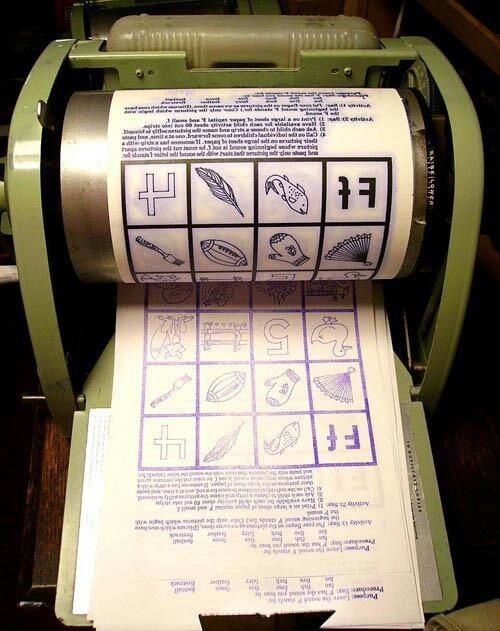 An old mimeograph machine prints a page filled with various symbols and texts in different fonts, featuring icons like a cross, shoe, and telephone.