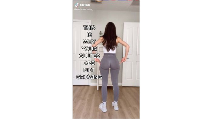 A woman showing her butt with the text 