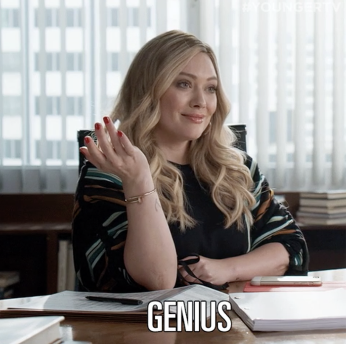 a woman declaring, "genius"