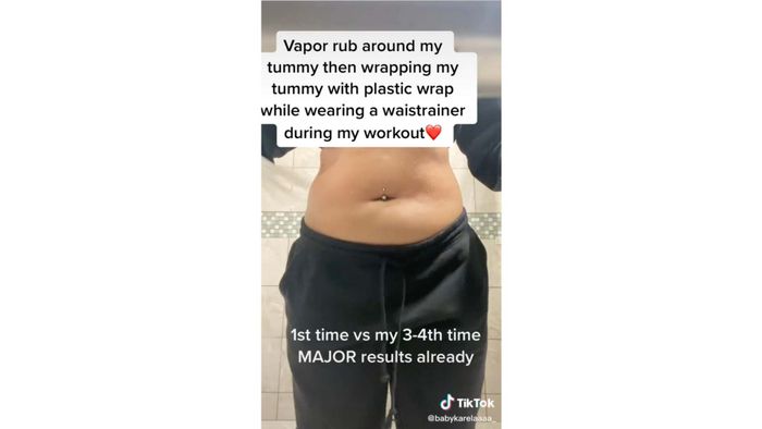 A woman’s belly with text: 