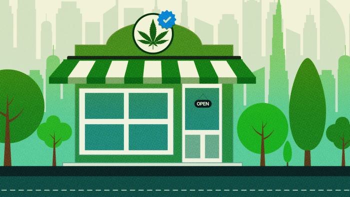An image of a store featuring a cannabis leaf on its sign and a blue