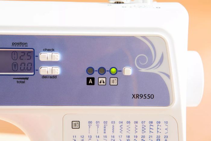 A close-up view of the control panel on the Brother XR9550 Sewing Machine.