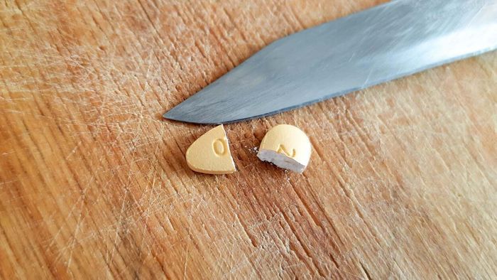 Think carefully before dividing a pill in half.