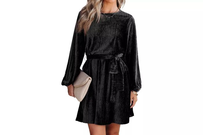The Happy Sailed Velvet Cocktail Dress is a chic option for a stylish night out. This elegant piece features long sleeves, an A-line silhouette, and a luxurious velvet fabric that offers a soft, comfortable fit. It includes a built-in belt that can be tied into a trendy bow at the waist, adding a fashionable touch. Available in various colors, this dress is perfect for a party look without sequins or sparkles.