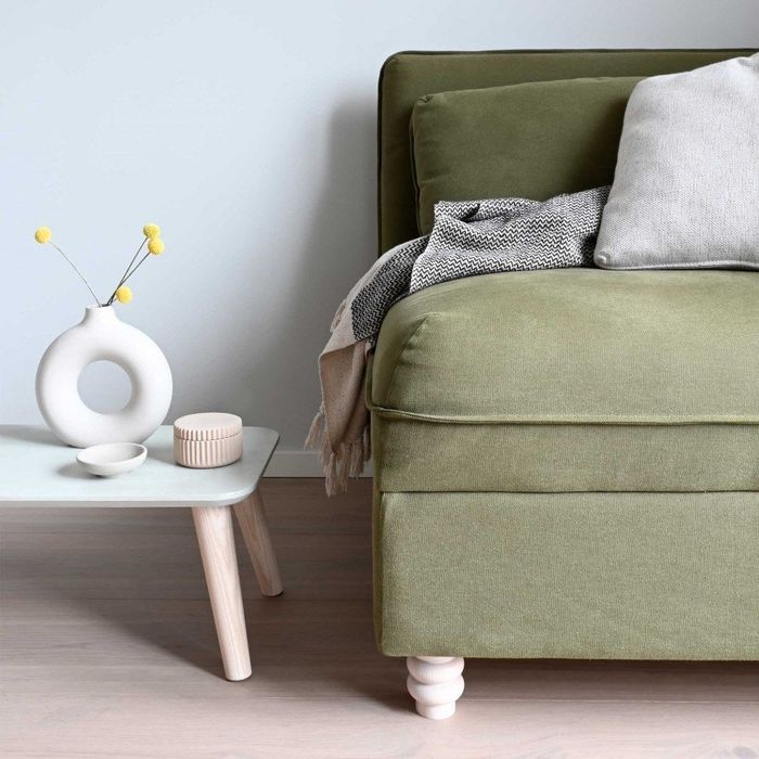 A sofa featuring elegantly curved legs.