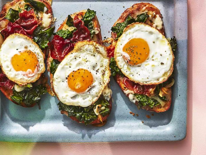 Spring Greens Tartine With Prosciutto, Fontina, and a Fried Egg