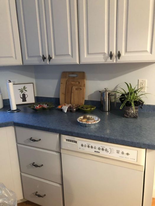 Before: A reviewer's dark blue countertop in its original state.