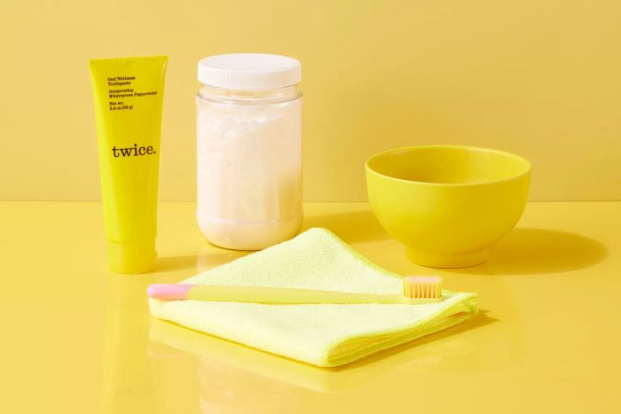 Paste, baking soda, cloth, and a toothbrush for cleaning white leather