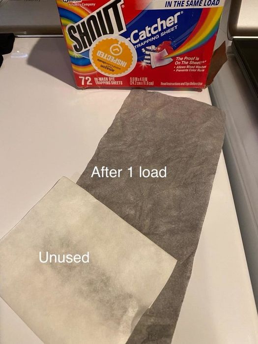 A reviewer’s photo showing a white unused sheet next to a gray sheet that has absorbed dye from a single wash