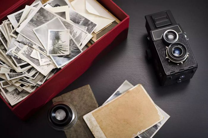 A box filled with old photographs