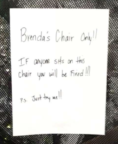 A handwritten note that says: 'Brenda's Chair Only! Sit in this chair and you'll be fired! P.S. Go ahead, try me!'