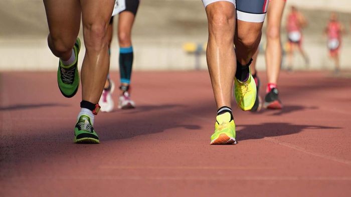 A group of runners sharing the track side by side