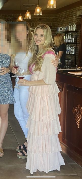 The author wearing a pink dress.