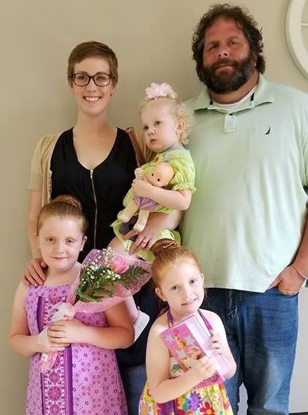 Dina Zirlott in 2018, pictured with her husband, Lance, and their three daughters: Aine (7), Ariadne (5), and Asher (3)