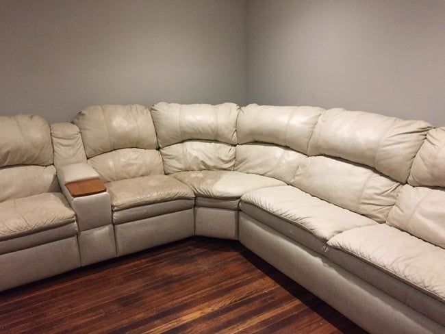 A reviewer’s couch with one side cleaned using the leather polishing formula