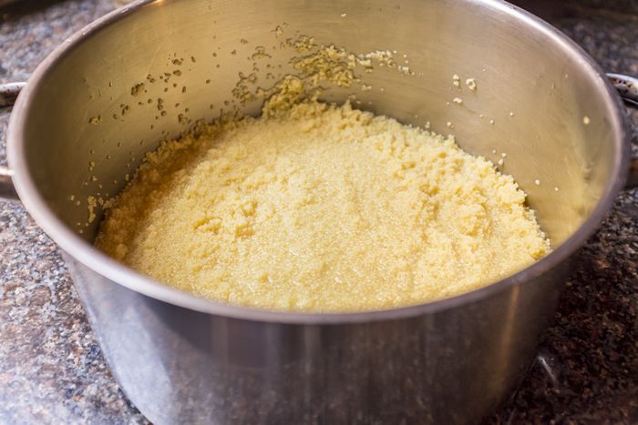 A large pot filled with fluffy couscous.