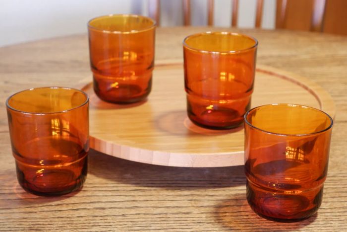 Four Our Place Night and Day Glasses arranged on a kitchen table