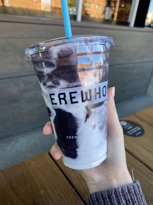 The author holding up a smoothie