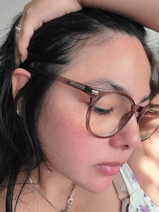 A close-up of a reviewer's clean and clear skin