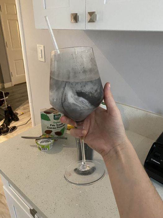 The author holding up her smoothie