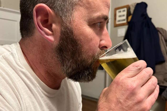 A person enjoying beer from a Duralex Unie Glass Tumbler