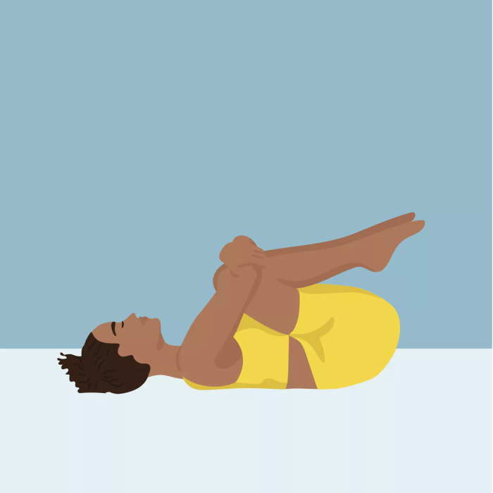 Yoga stretches for lower back: Knee hug (knees to chest)