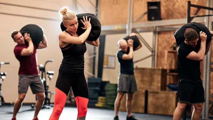 Discover the top 10 sandbag exercises you can do at the gym or at home for a full-body workout.