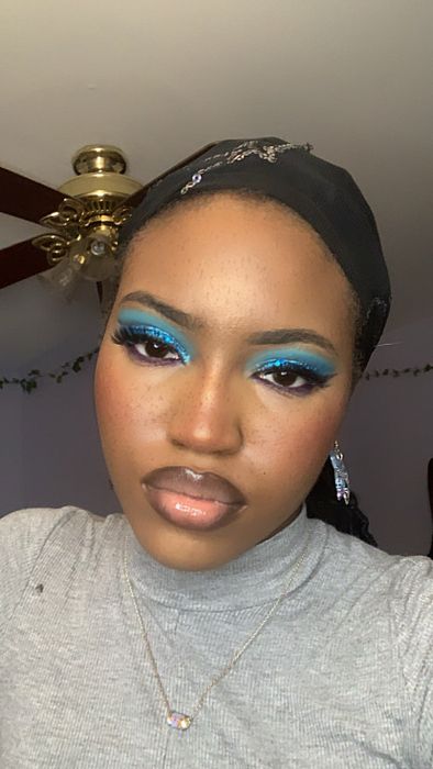 A reviewer showcasing a flawless makeup look after using the primer