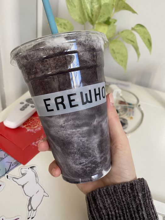The author holding up a smoothie