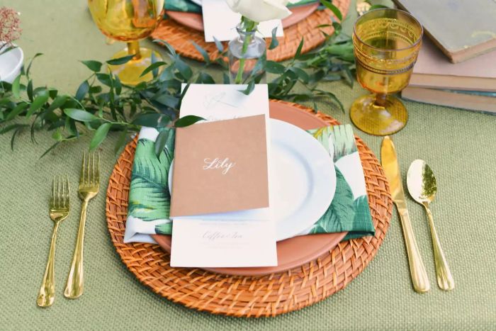 A card with the name Lily placed on a plate at a beautifully arranged event table