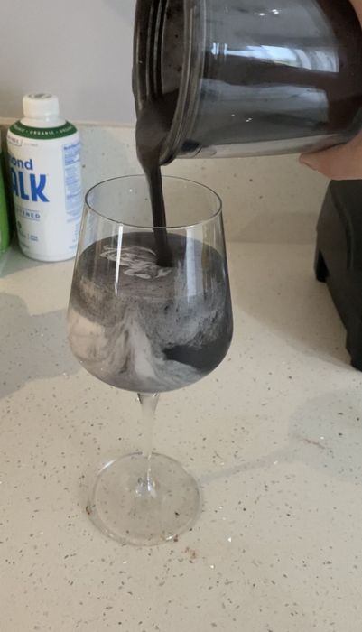 The author pouring her smoothie