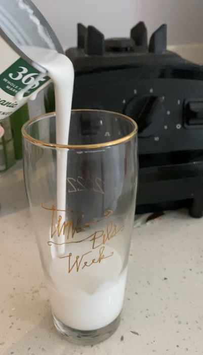 The author pouring coconut cream into a cup