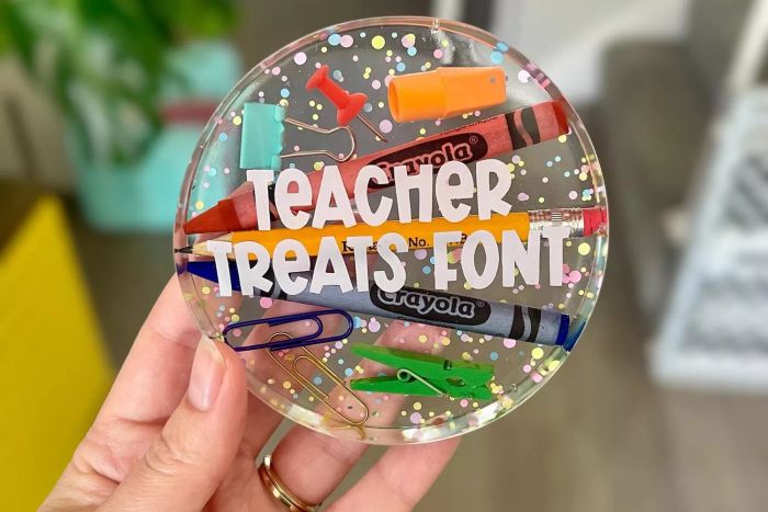 A person holding the CooperAndClaire Teacher Appreciation Coaster