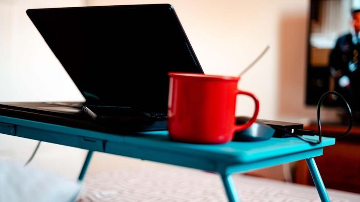 A lap desk tailored for hospital bed use