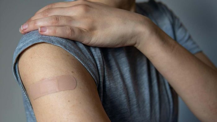 Is it safe to get the flu shot and COVID booster in the same arm?