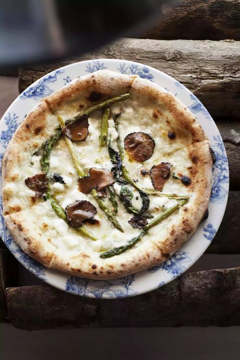 A fresh pizza resting on a plate, ready to be enjoyed.