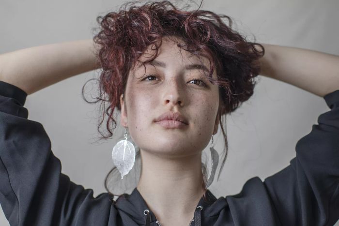 Explore a vast collection of stunning creative photos and videos. Discover inspiring images, editorial visuals, and more. Search by image or video to find the perfect portrait of a young woman with bold, oversized earrings.