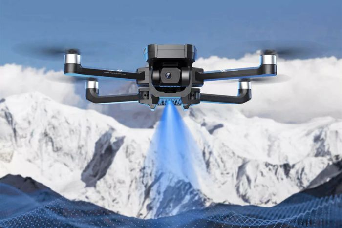 The Holy Stone HS720G 2-Axis Gimbal GPS Drone soaring above snow-covered mountains.