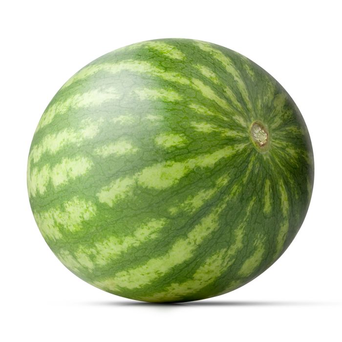 A whole watermelon with a striped rind against a plain background